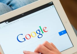 A person visiting Google on an iPad.
