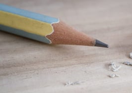 A photo of a pencil and eraser