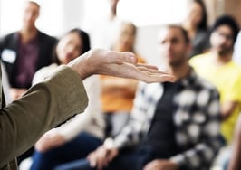 A focus group listening to a speaker.