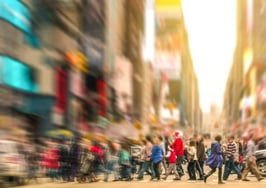 A crowd of people in a busy city
