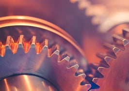 A close-up of two gears