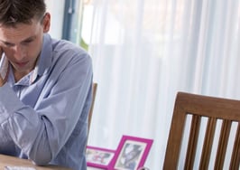 A man worried about paying his bills