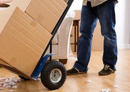 Moving boxes on a dolly.