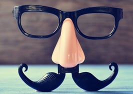 A pair of glasses with nose and mustache attached