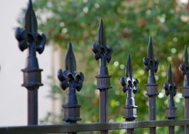 A gated fence around a park
