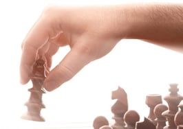 A man playing chess with a machine