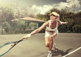 A woman playing tennis.