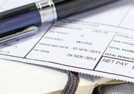 A closeup of a paycheck