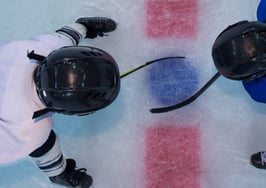Two hockey players facing off