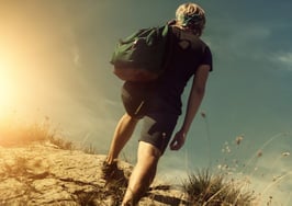 A man climbing a mountain