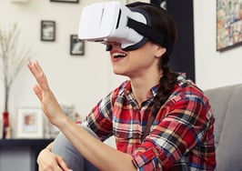 A woman wearing virtual reality goggles