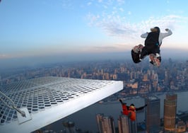 BASE jumpers jumping off a ledge