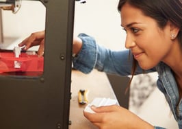 An architect printing on a 3-D printer.