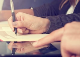 A group of people taking notes