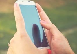 A woman using an Android device