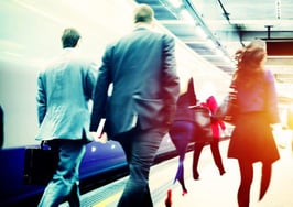 Passengers commuting to work via train