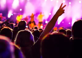 A rear view of an audience at a pop concert