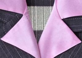 A pink collar in a women's suit