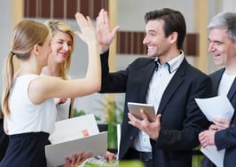 A group of people high-fiving