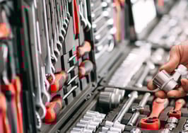 A man's hands selecting tools
