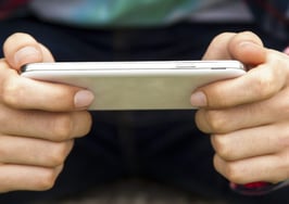 Two hands holding a mobile phone