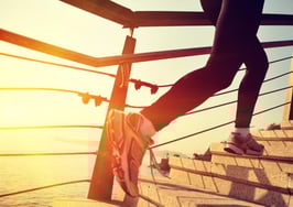 A woman climbing stairs