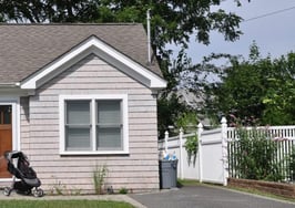 A small home with a baby stroller in front