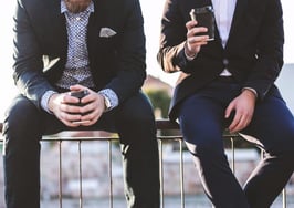 Two millennials drinking coffee