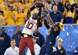 A ma intercepting a football