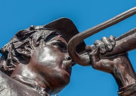 A statue playing a trumpet