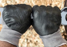 Two hands tightening a bolt