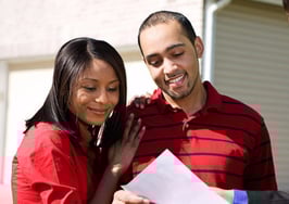 A couple looking at a home with an agent