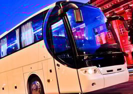 A bus driving down a city street