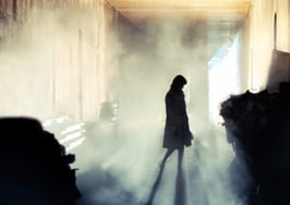 A woman's silhouette in a haunted room