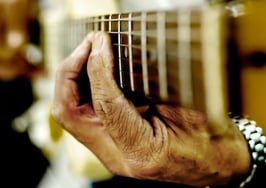 A man playing guitar