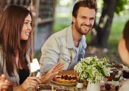 A group of young people around a Thanksgiving table