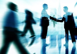 A handshake in the midst of action