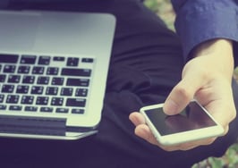 A man on his laptop and phone at the same time