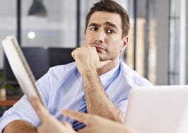 A man looking skeptically at his interviewer