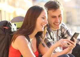 Two young tourists looking for directions