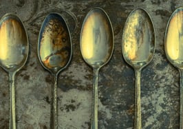 Tarnished spoons on a tarnished tray