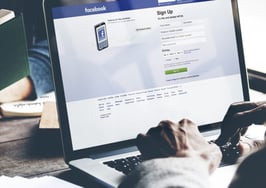 A man on Facebook in a shared office space