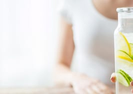A woman with a glass of water