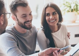 A couple looking at a loan contract