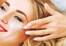 A woman getting gel treatment on her eyes