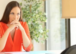 A woman looking worried at an appointment