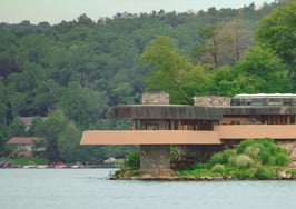 An island home inspired by Frank Lloyd Wright in New York to be marketed as corporate retreat