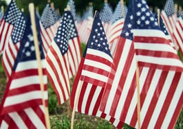 These agents are handing out 11,000 American flags this Fourth of July