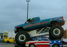 Monster Truck riding over cars