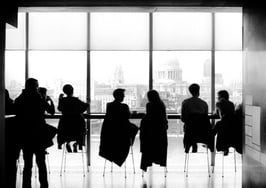 People in silhouette shadows office